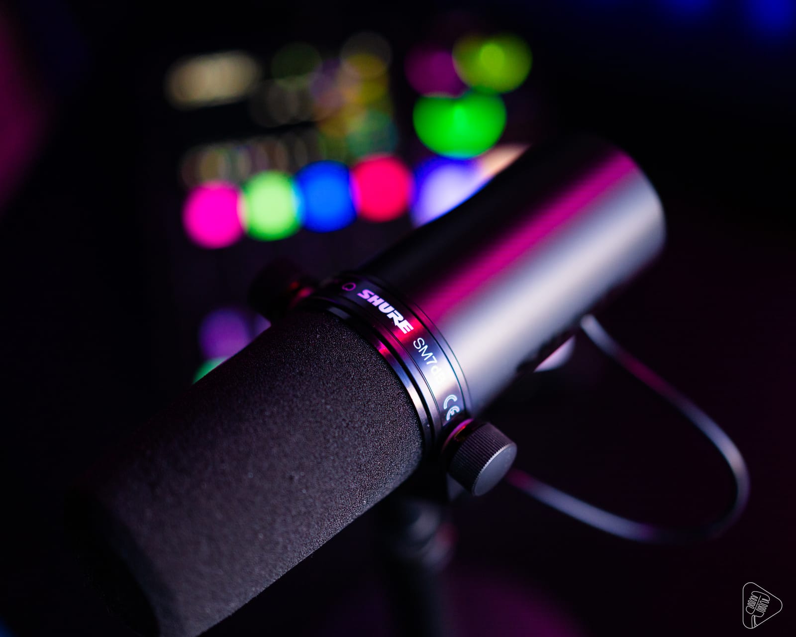 Shure SM7DB Mircrophone in Foreground with Rodecaster Pro II Integrated Audio Production Studio in Background